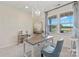 Bright office space featuring a decorative light fixture, neutral paint, and a large window with a beautiful view at 407 Sunharvest Ln, Indian Trail, NC 28079