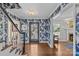 Elegant foyer with hardwood floors, a floral wallpaper, and a staircase to the left at 4300 Denbigh Dr, Charlotte, NC 28226