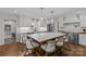 Modern kitchen with marble countertops, large island, stainless steel appliances and lighting at 4300 Denbigh Dr, Charlotte, NC 28226