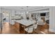 Kitchen area with white cabinets, stainless steel appliances, and a large island with seating at 4300 Denbigh Dr, Charlotte, NC 28226