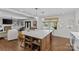 Open concept kitchen featuring hardwood floors, stainless steel appliances, and a large center island at 4300 Denbigh Dr, Charlotte, NC 28226