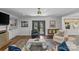 Bright living room with hardwood floors, built-in shelving, french doors, and stylish decor at 4300 Denbigh Dr, Charlotte, NC 28226