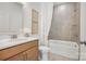 Bright bathroom with a vanity, toilet, and a bathtub-shower combination with tiled walls at 4775 Formation Dr # 99, Lancaster, SC 29720