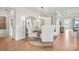 Elegant dining room with a round wooden table, chic white chairs, and modern lighting at 4775 Formation Dr # 99, Lancaster, SC 29720