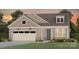 Charming craftsman-style home with a two-car garage, manicured lawn, and inviting front porch at 4775 Formation Dr # 99, Lancaster, SC 29720