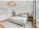 Cozy main bedroom with a comfortable bed, modern lamps, and a view into the en suite bathroom at 4775 Formation Dr # 99, Lancaster, SC 29720