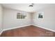 Finished basement space with hardwood floors, trim, and natural light at 4836 Cheviot Rd, Charlotte, NC 28269