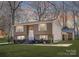 Charming split-level home featuring a well-manicured lawn, complemented by the house's warm exterior at 4836 Cheviot Rd, Charlotte, NC 28269