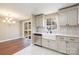 Kitchen with updated appliances and an eat-in area with sliding doors to a rear deck at 4836 Cheviot Rd, Charlotte, NC 28269