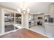 Beautifully updated kitchen featuring stainless steel appliances, and modern cabinetry, with an adjacent dining area and sliding door to deck at 4836 Cheviot Rd, Charlotte, NC 28269