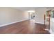 Spacious living room with hardwood flooring, and staircase access at 4836 Cheviot Rd, Charlotte, NC 28269