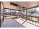 View of the covered outdoor deck with ceiling fan and view of backyard at 4836 Cheviot Rd, Charlotte, NC 28269