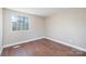 Room with hardwood floors, neutral paint, and natural light at 4836 Cheviot Rd, Charlotte, NC 28269