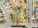 Aerial view of property showing home, lot, parking, and surrounding neighborhood at 4928 Tuckaseegee Rd, Charlotte, NC 28208