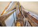 Lofted attic with wooden beams and metal grating bridge, offering a rustic and functional space at 4928 Tuckaseegee Rd, Charlotte, NC 28208