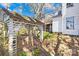 Tranquil backyard featuring a decorative pergola over an old well at 4928 Tuckaseegee Rd, Charlotte, NC 28208