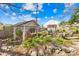 Picturesque backyard with a charming pergola covered well and garden at 4928 Tuckaseegee Rd, Charlotte, NC 28208