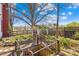 Backyard featuring a decorative pergola and garden area with access to a well at 4928 Tuckaseegee Rd, Charlotte, NC 28208