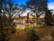 Charming historic home with large porch and mature trees on an expansive landscaped lot at 4928 Tuckaseegee Rd, Charlotte, NC 28208