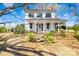 Charming two-story home with a covered front porch and landscaped front yard at 4928 Tuckaseegee Rd, Charlotte, NC 28208
