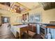 Rustic kitchen with wooden countertops, island, stainless steel appliances and wooden floors at 4928 Tuckaseegee Rd, Charlotte, NC 28208