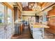 Spacious kitchen featuring custom cabinets, butcher block countertops and pendant lighting at 4928 Tuckaseegee Rd, Charlotte, NC 28208