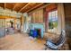 Living room boasting wood walls, a colorful fireplace, and views from the many windows at 4928 Tuckaseegee Rd, Charlotte, NC 28208