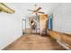 Inviting room featuring original wood floors, white walls, and vintage decor, offering a unique character at 4928 Tuckaseegee Rd, Charlotte, NC 28208
