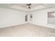 This is an empty bedroom with neutral carpet at 5672 Wrenfield Ct, Charlotte, NC 28277