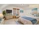 Serene bedroom with a cozy bed, natural light, and stylish decor, creating a relaxing and comfortable space at 5672 Wrenfield Ct, Charlotte, NC 28277