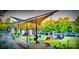 Community space with canopies, seating, and people gathering, promoting a vibrant neighborhood atmosphere at 5672 Wrenfield Ct, Charlotte, NC 28277