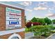 Signage for Providence Commons featuring local businesses like Harris Teeter and Lowe's at 5672 Wrenfield Ct, Charlotte, NC 28277