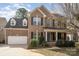 Charming brick home with a well-manicured front yard and a welcoming covered entrance at 5672 Wrenfield Ct, Charlotte, NC 28277