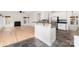 Open kitchen featuring tile floors, granite countertops, stainless steel appliances, and a view to the living room at 5672 Wrenfield Ct, Charlotte, NC 28277