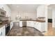 Modern kitchen with stainless steel appliances, granite countertops, and slate tile flooring at 5672 Wrenfield Ct, Charlotte, NC 28277