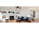 Comfortable living room with a fireplace, hardwood floors, and stylish decor, ideal for relaxation and entertaining at 5672 Wrenfield Ct, Charlotte, NC 28277