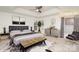 Luxurious main bedroom with a king-sized bed, plush rug, and stylish decor for a relaxing retreat at 5672 Wrenfield Ct, Charlotte, NC 28277