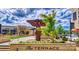 The Terrace entrance sign with views of Carolina Ale House and other stores in the shopping center at 5672 Wrenfield Ct, Charlotte, NC 28277