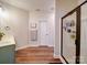 Modern bathroom features a stylish glass shower, wood-look floors, and neutral wall color at 572 Church St, Locust, NC 28097