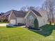 Charming brick home with well-maintained lawn and inviting front porch at 572 Church St, Locust, NC 28097
