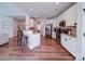 Stylish kitchen features white cabinetry, stainless steel appliances, and a breakfast bar with seating at 572 Church St, Locust, NC 28097