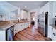 Modern kitchen featuring stainless steel appliances and granite countertops at 572 Church St, Locust, NC 28097