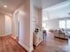 Hallway view into living area showcasing wood floors and a vaulted ceiling at 572 Church St, Locust, NC 28097