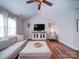 Cozy living room with high ceilings, ceiling fan, and comfortable furnishings at 572 Church St, Locust, NC 28097