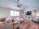 Comfortable living room with a large sofa, stylish decor, and vaulted ceiling at 572 Church St, Locust, NC 28097