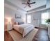 Inviting main bedroom with tray ceiling, natural light, and neutral decor at 572 Church St, Locust, NC 28097
