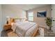 Cozy bedroom featuring a comfortable bed, stylish nightstands, and natural light from a window at 574 Reid St, Belmont, NC 28012