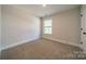 Bright bedroom with a large window offering ample natural light and neutral wall color at 574 Reid St, Belmont, NC 28012