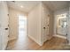 Hallway with wood-look floors leading to bedroom and bathroom at 574 Reid St, Belmont, NC 28012