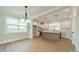 Modern kitchen with white cabinets, quartz countertops, stainless steel appliances, and a stylish center island at 574 Reid St, Belmont, NC 28012